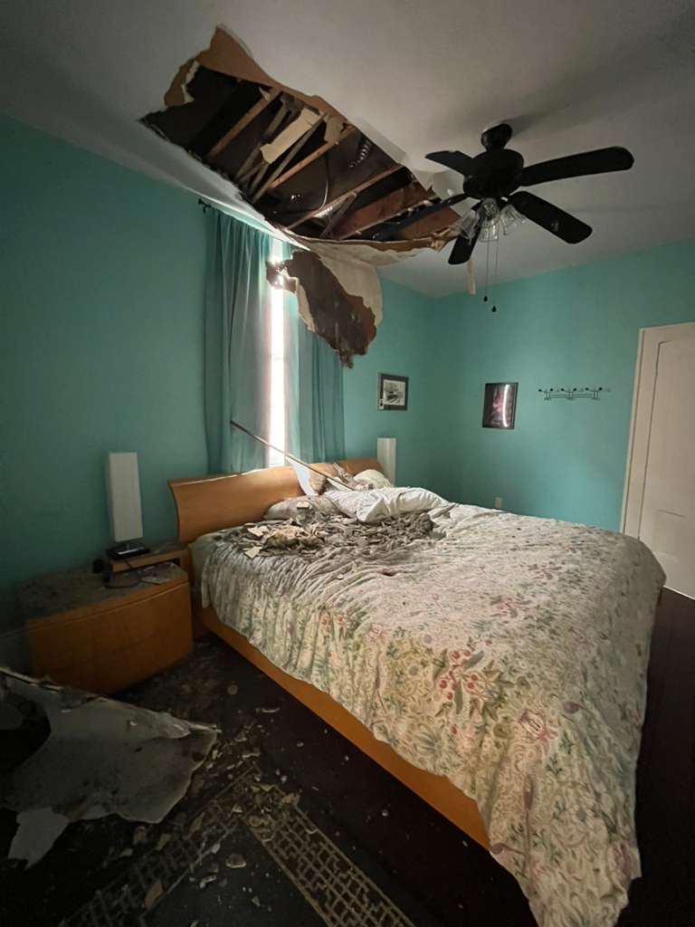 Bedroom ceiling collapse, drywall damage before repair, New Orleans